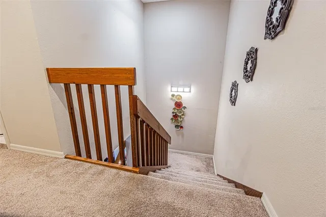 an entryway with stairs and a window