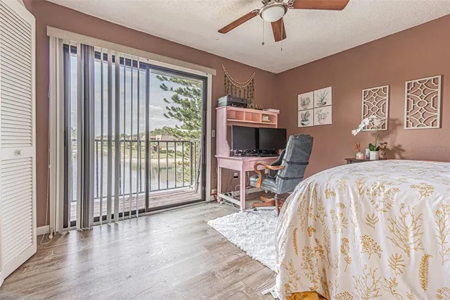a view of a livingroom with furniture window and wooden floor