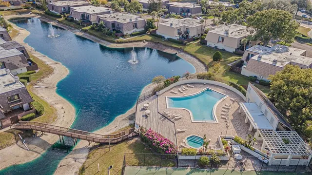 an aerial view of a house with outdoor space