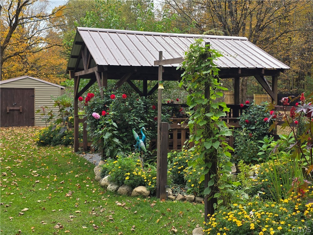 1053 Grant Road Russia, NY 13324 - Photo 29 of 47 A charming wooden gazebo with a metal roof overloo