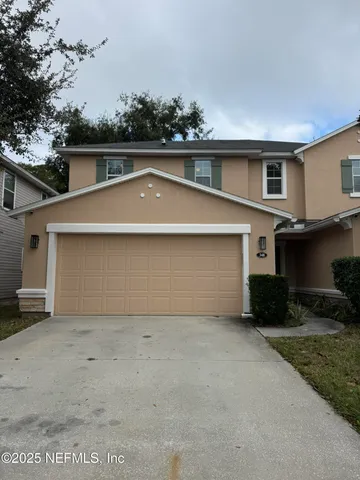 front view of a house with a garage