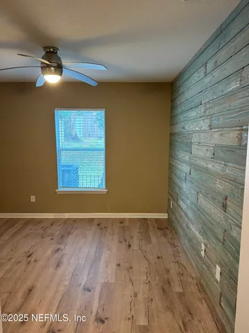 a view of room with hardwood floor