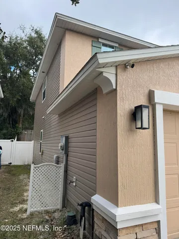 a house that has tree in front of it