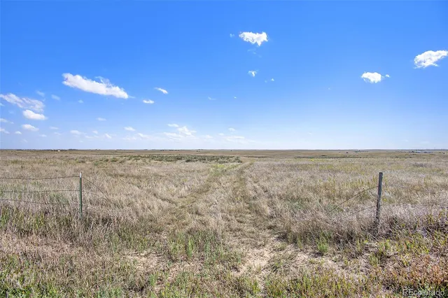 a view of an empty room and mountain view