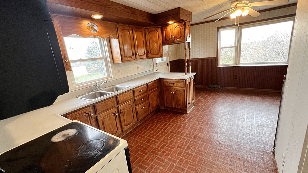 21743 Ideal Road Chadwick, IL 61014 - Photo 11 of 35 a kitchen with stainless steel appliances granite countertop a stove a sink and a microwave