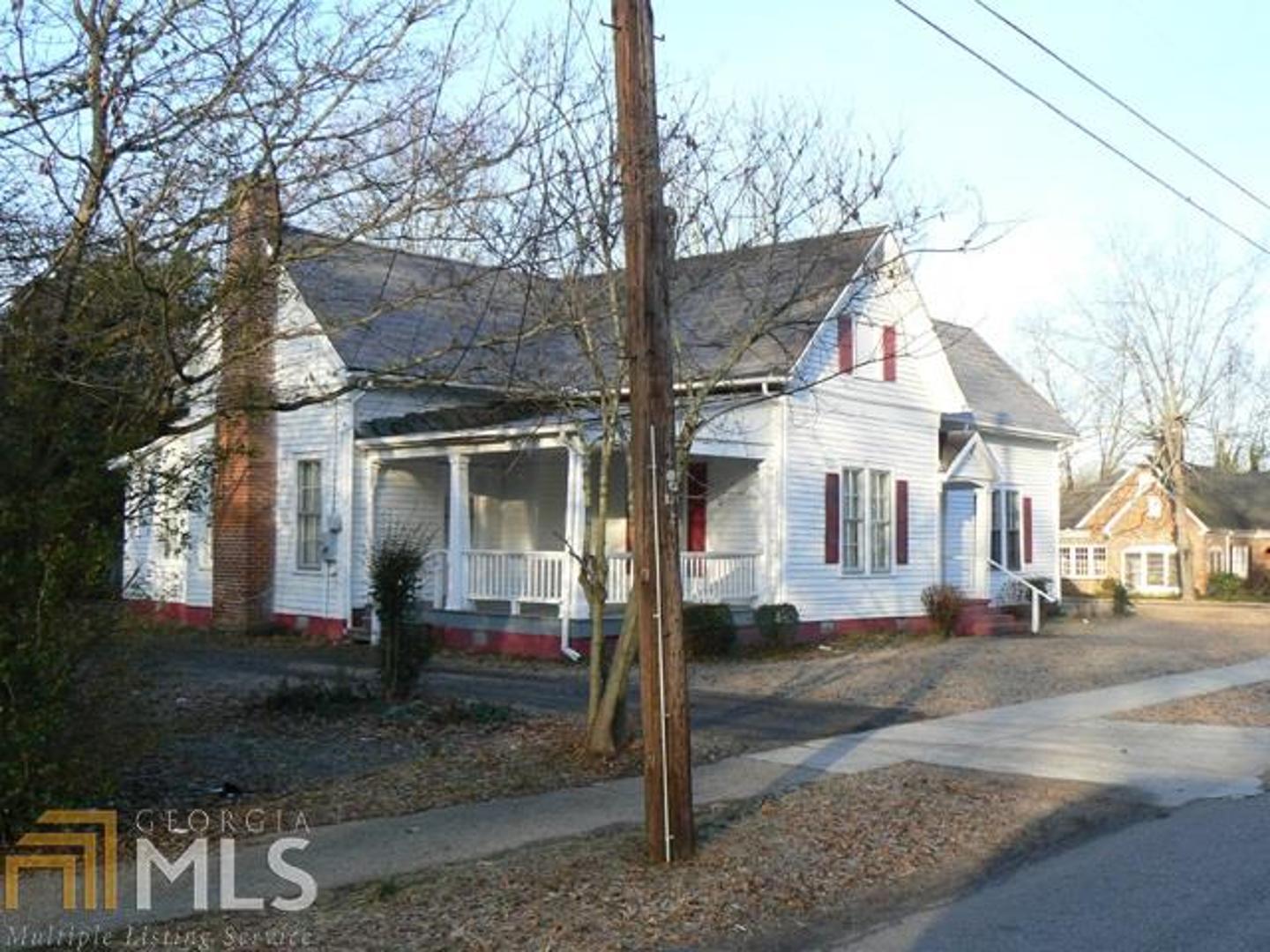 a front view of a house with street