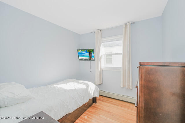 122 Retford Avenue Staten Island, NY 10312 - Photo 15 of 29 a bedroom with a bed and a window