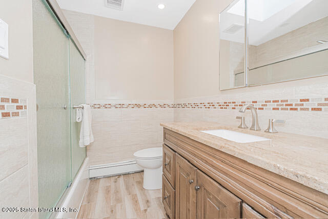 122 Retford Avenue Staten Island, NY 10312 - Photo 17 of 29 a bathroom with a granite countertop sink toilet and shower