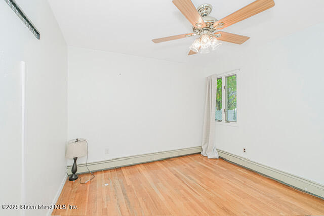 122 Retford Avenue Staten Island, NY 10312 - Photo 18 of 29 an empty room with a window and a ceiling fan