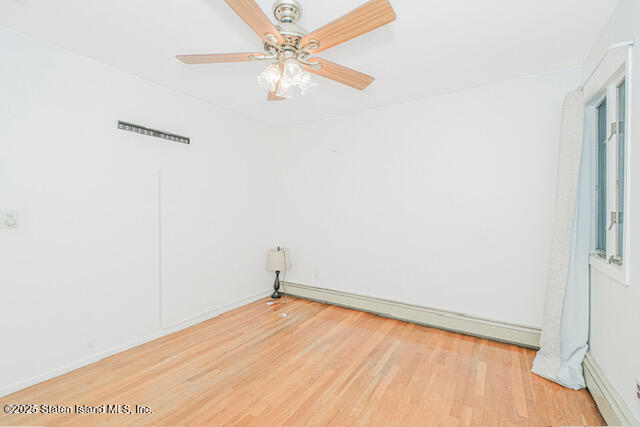 122 Retford Avenue Staten Island, NY 10312 - Photo 20 of 29 a view of a room with wooden floor