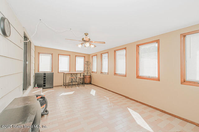 122 Retford Avenue Staten Island, NY 10312 - Photo 24 of 29 a spacious bedroom with a bed and a chandelier
