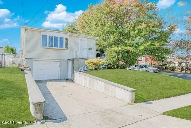 a view of backyard with a garden and entertaining space