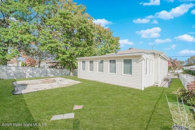 122 Retford Avenue Staten Island, NY 10312 - Photo 5 of 29 a view of a house with backyard and sitting area