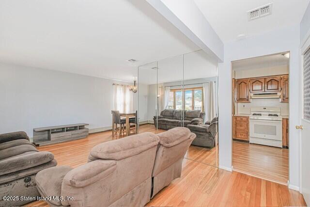 122 Retford Avenue Staten Island, NY 10312 - Photo 10 of 29 a living room with furniture and wooden floor