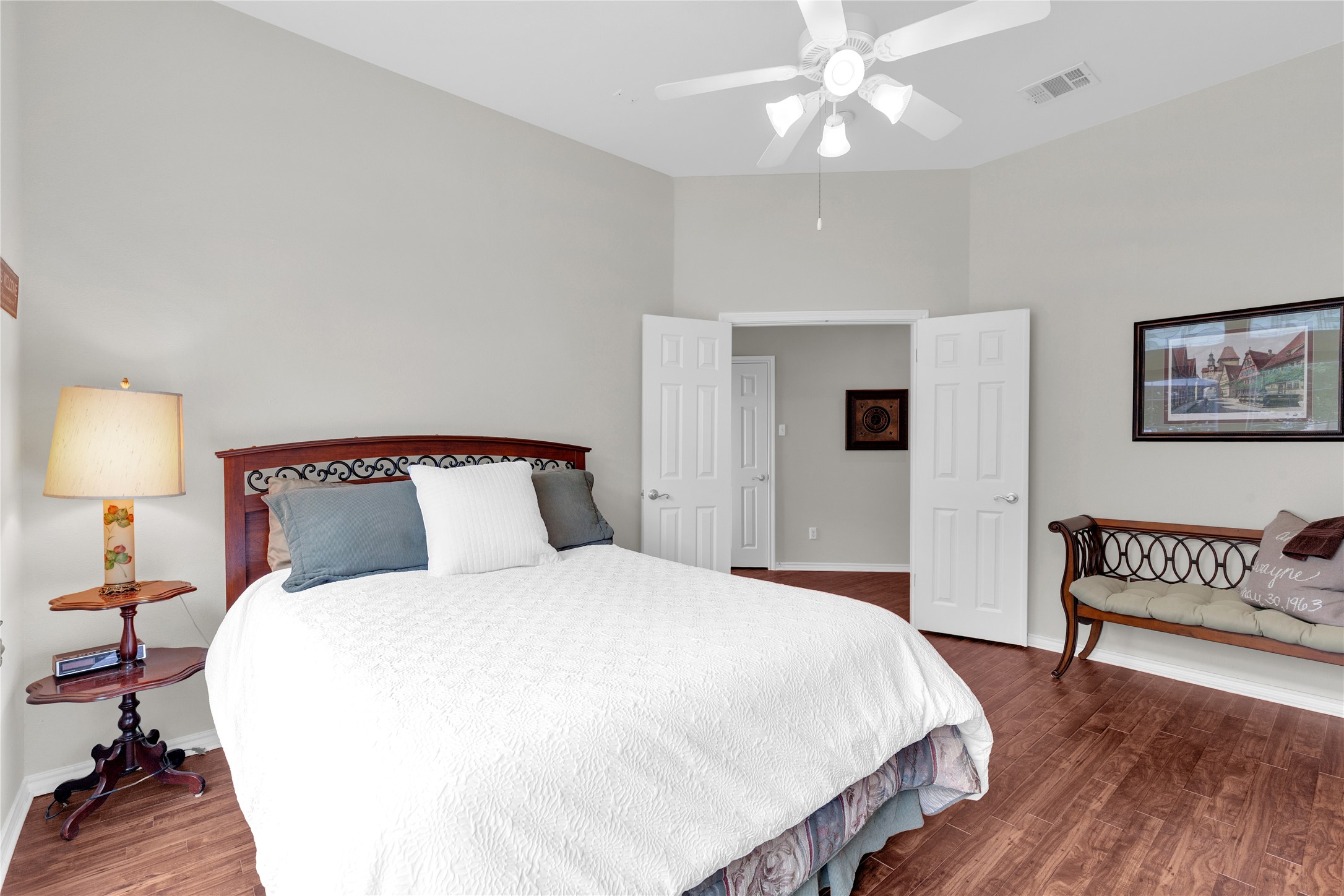 2918 Ranch Road 620 North, Unit L173 Austin, TX 78734 - Photo 17 of 35 Bedroom featuring wood finished floors, baseboards, a towering ceiling, and a ceiling fan