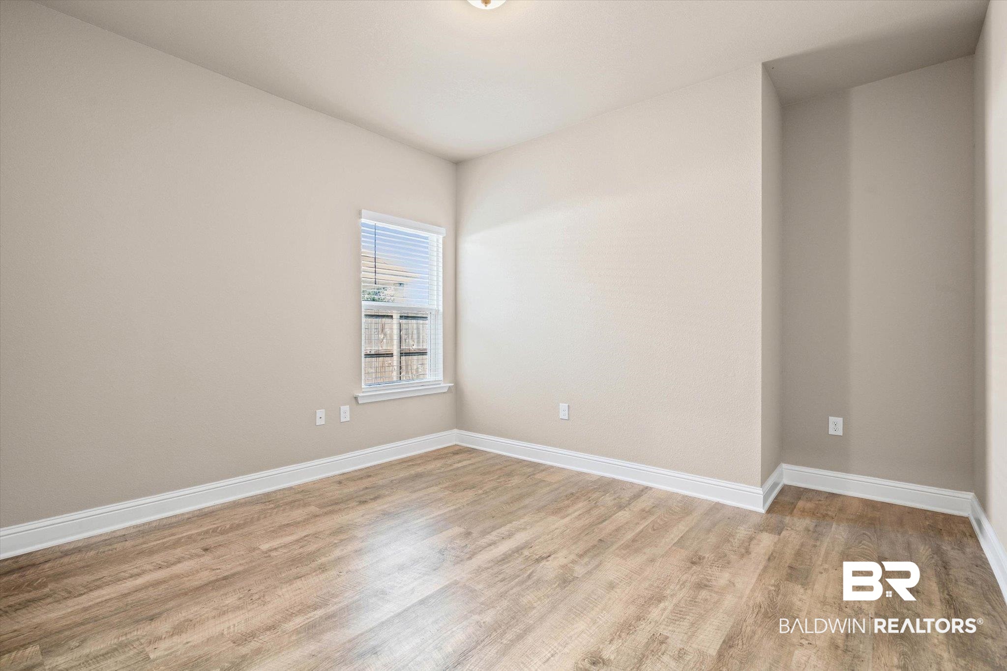 22976 Lieutenant Avenue Foley, AL 36535 - Photo 12 of 30 Spare room with light wood finished floors and baseboards