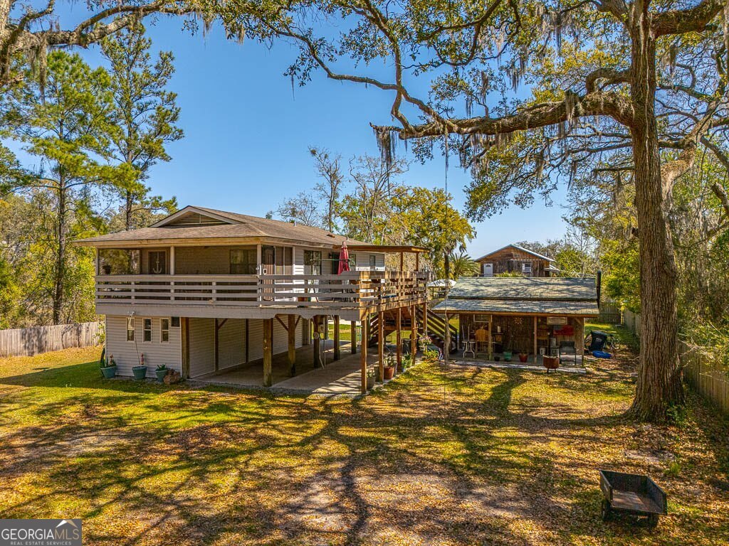 33 Warren Avenue Waverly, GA 31565 - Photo 62 of 63 a front view of a house with a ocean view