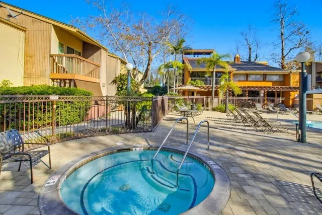 a view of a swimming pool with a patio