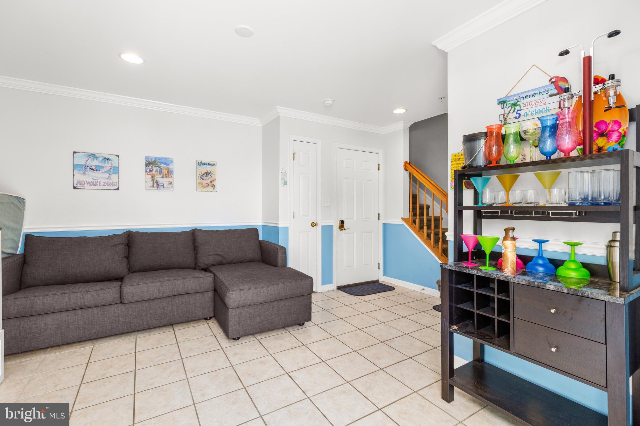 617 Salt Spray Road, Unit B Ocean City, MD 21842 - Photo 32 of 72 a living room with furniture and a couch