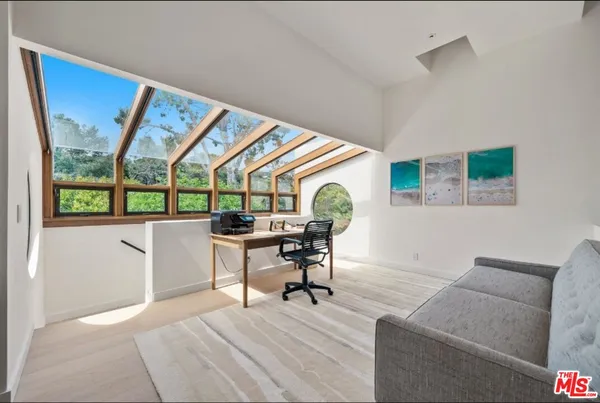 a bathroom with a large tub and sink