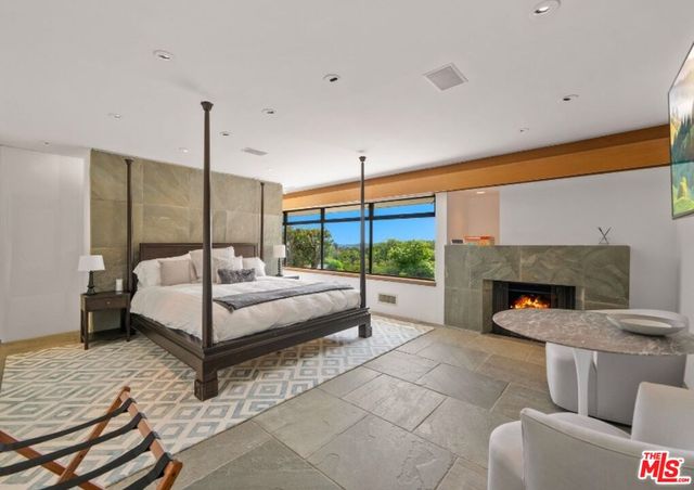 a view of kitchen with stainless steel appliances granite countertop a refrigerator and a sink