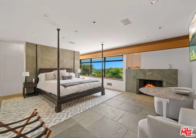 a view of kitchen with stainless steel appliances granite countertop a refrigerator and a sink