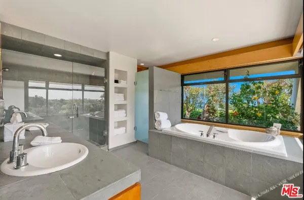 a bedroom with a bed and couch