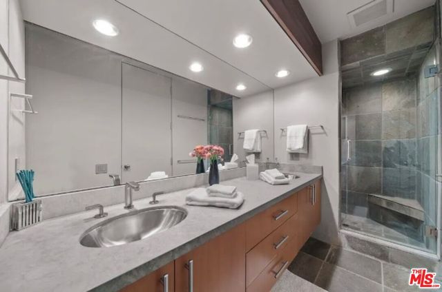 a living room with furniture and a lamp