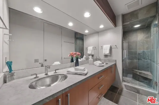 a living room with furniture and a lamp