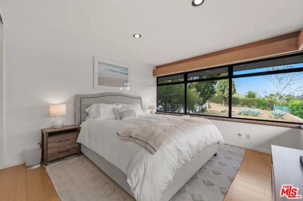 a view of a kitchen with a table and chairs