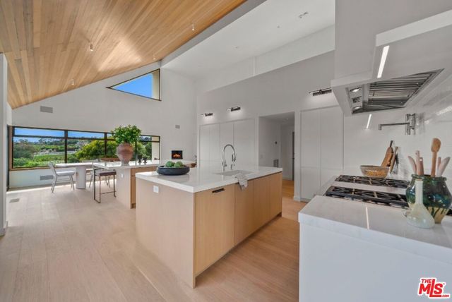a living room with furniture a fireplace and a table