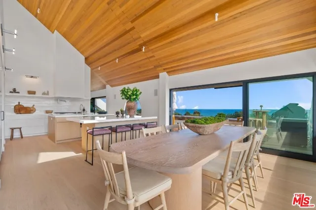 a kitchen with a table and chairs in it
