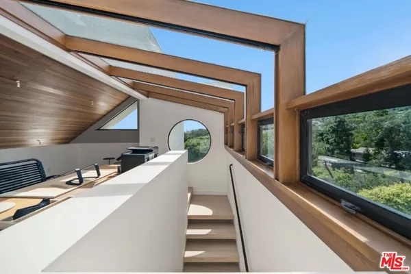 a bedroom with a bed and a fireplace