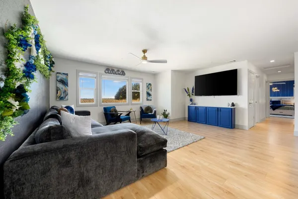 a bedroom with a bed and flat tv screen