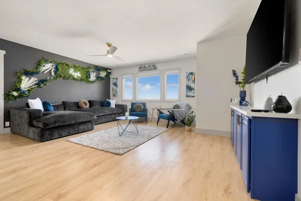 a large bedroom with a bed and a couch