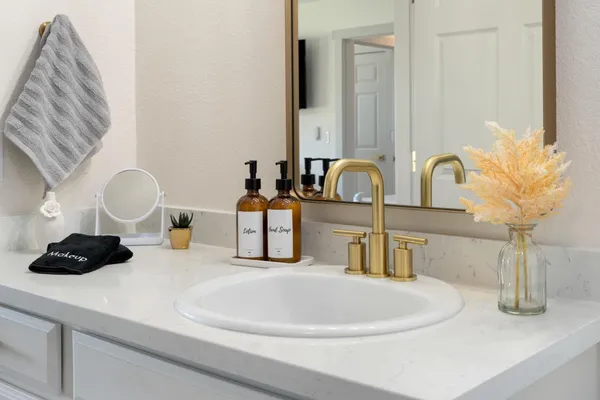 a kitchen with a sink and a large window