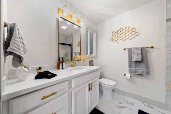 a view of an empty room with glass door and a window