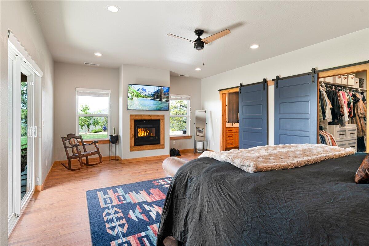 2220 Butte Falls Highway Eagle Point, OR 97524 - Photo 25 of 69 a bedroom with a bed and a fireplace