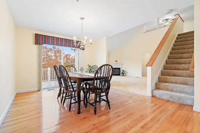 a view of a dining room with furniture entryway and wooden floor