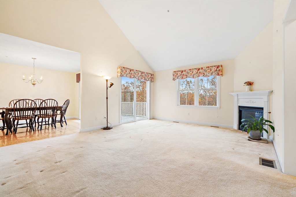 7 E Strawberry Lane, Unit E Hudson, MA 01749 - Photo 14 of 38 an empty room with furniture and windows