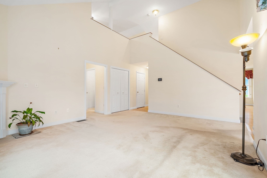 7 E Strawberry Lane, Unit E Hudson, MA 01749 - Photo 15 of 38 a view of an empty room with a window