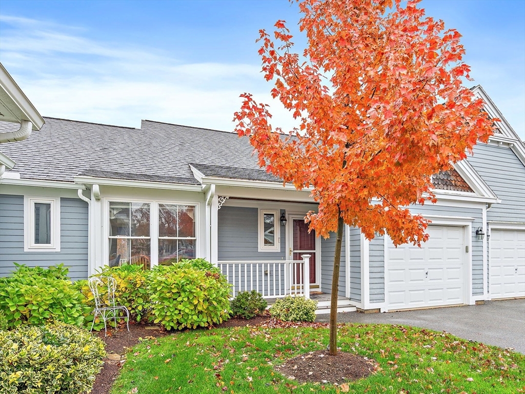 7 E Strawberry Lane, Unit E Hudson, MA 01749 - Photo 2 of 38 front view of a house with a yard