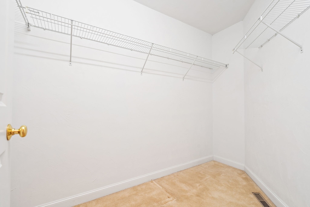 7 E Strawberry Lane, Unit E Hudson, MA 01749 - Photo 21 of 38 a view of a rack on the wall