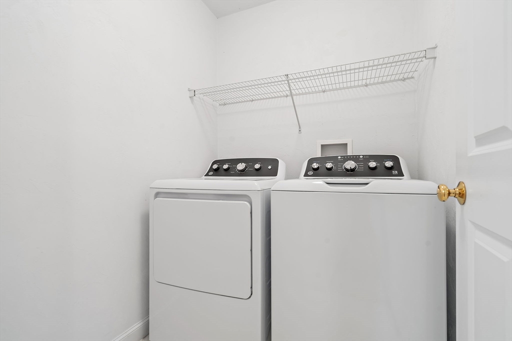 7 E Strawberry Lane, Unit E Hudson, MA 01749 - Photo 26 of 38 a utility room with dryer and washer