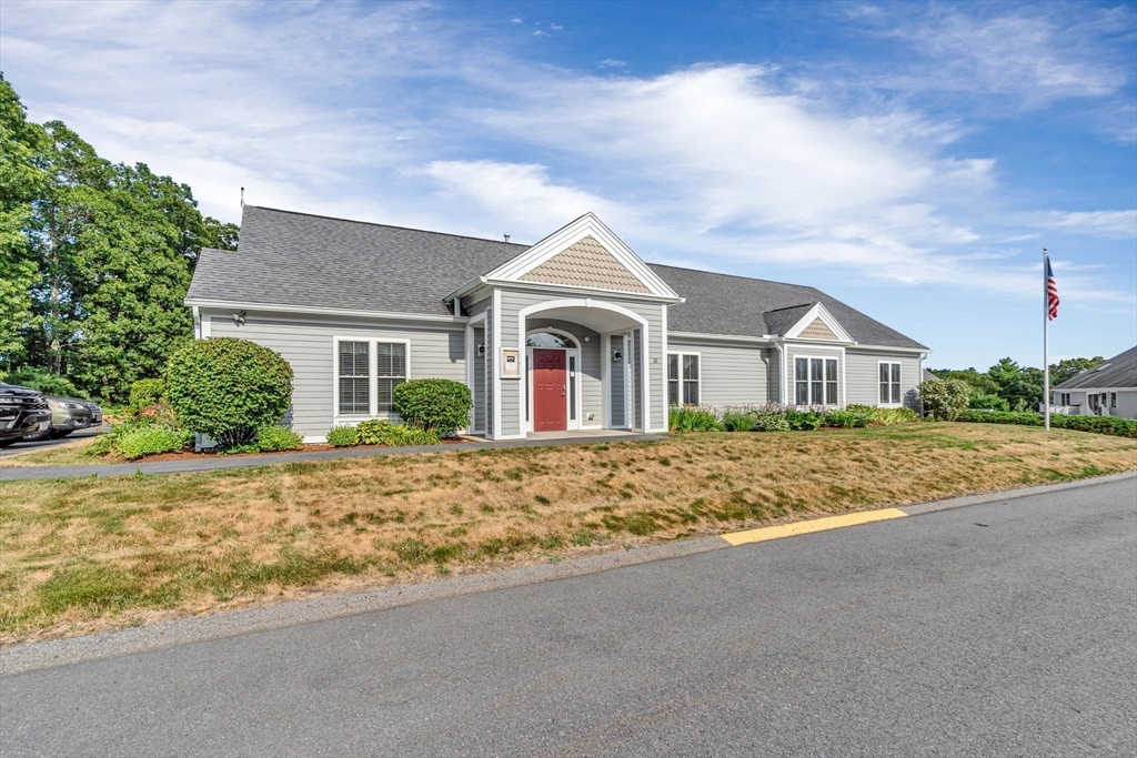 7 E Strawberry Lane, Unit E Hudson, MA 01749 - Photo 36 of 38 front view of a house with a dirt yard