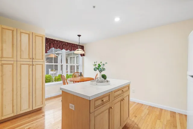 a kitchen with a sink and a refrigerator