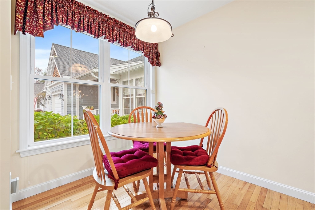 7 E Strawberry Lane, Unit E Hudson, MA 01749 - Photo 10 of 38 a view of a dining room with furniture window and outside view