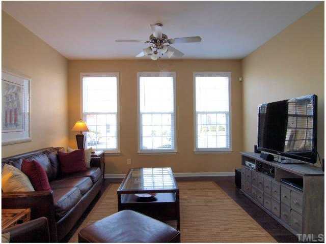 8220 City Loft Court Raleigh, NC 27613 - Photo 8 of 19 a living room with furniture and a flat screen tv