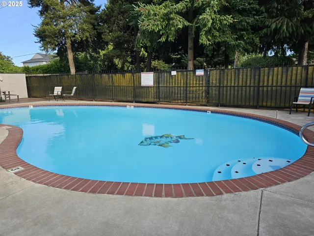 a view of a swimming pool and outdoor space