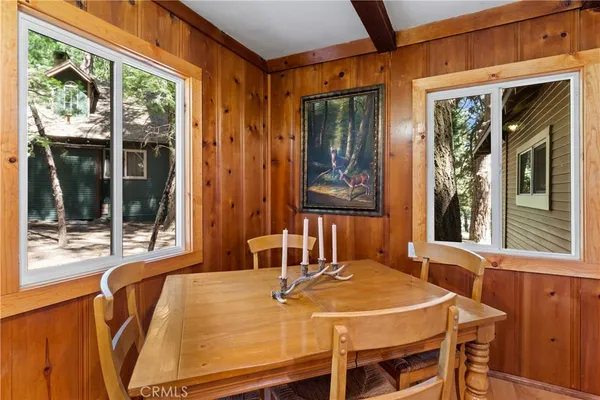 a dining room with a table and chairs